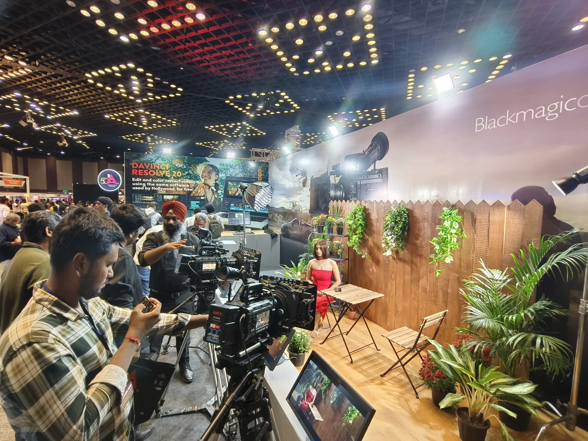 Visitors exploring professional cinema equipment at Cinematica 2025